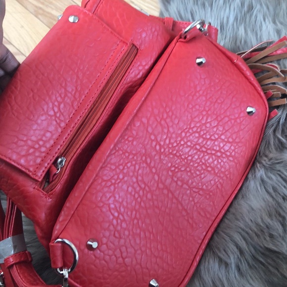 Brick Red Skull Fringe Backpack Purse with Studs.